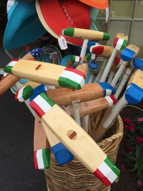 polo mallets in a basket
