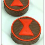 chocolate mini cakes with an hourglass black widow logo