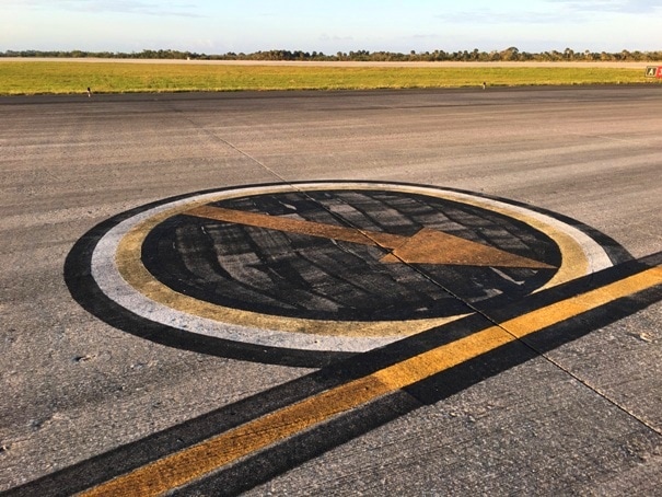 arrow painted on runway