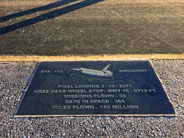plaque on side of runway with space shuttle