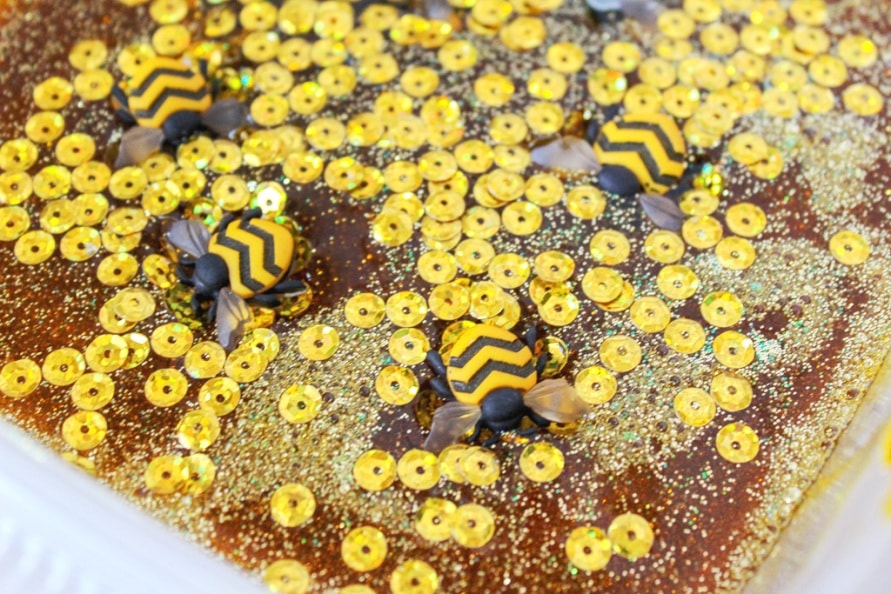 gold sequins glitter plastic honey bees in slime mixture