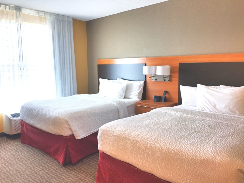 two queen beds in a hotel room