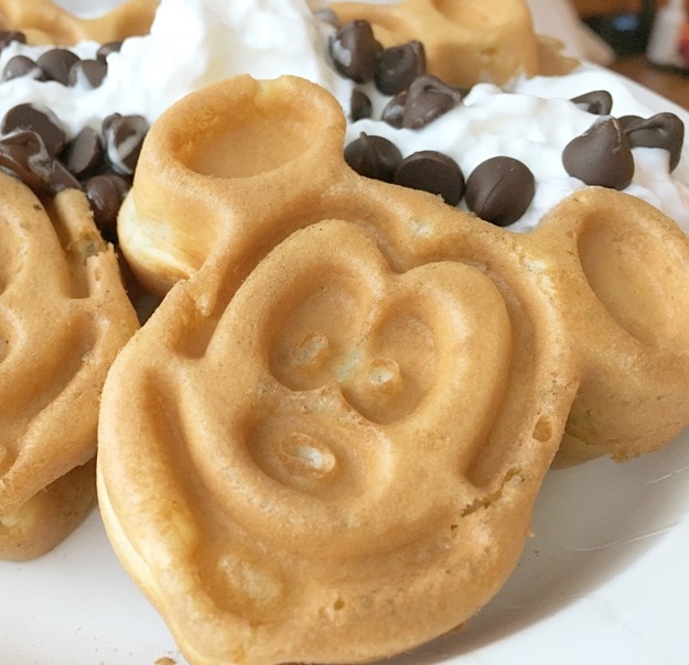 mickey mouse waffles with chocolate chips and whipped cream