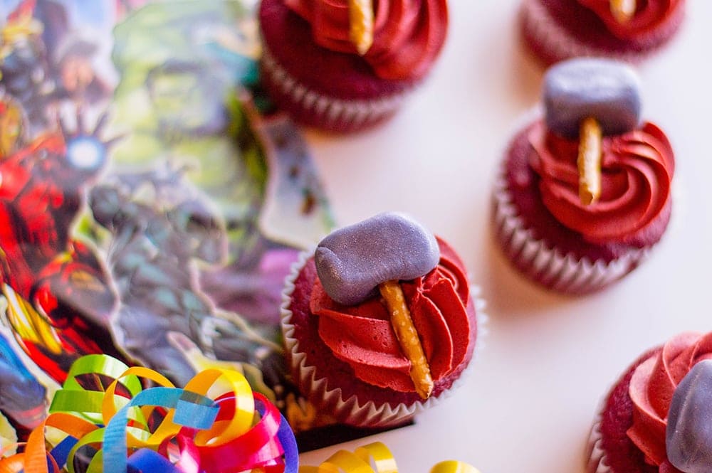 red velvet cupcakes with red frosting and min hammers on top for Thor superhero Avenger