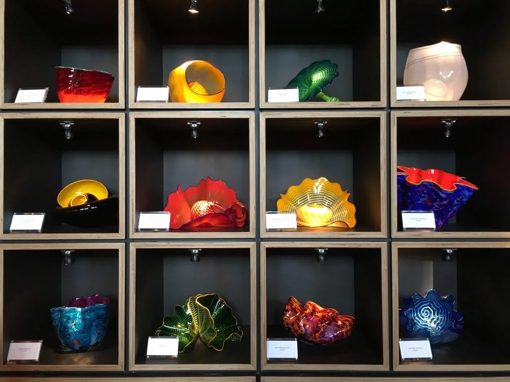 Shelves full of Chihuly Glass sculptures for sale at Biltmore Estate