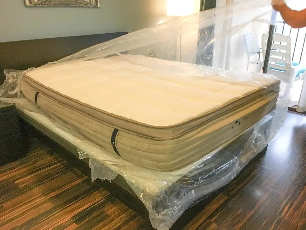 plastic wrapping being removed from dream cloud mattress 
