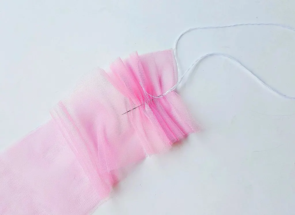 running thread with needle pink mesh tulle