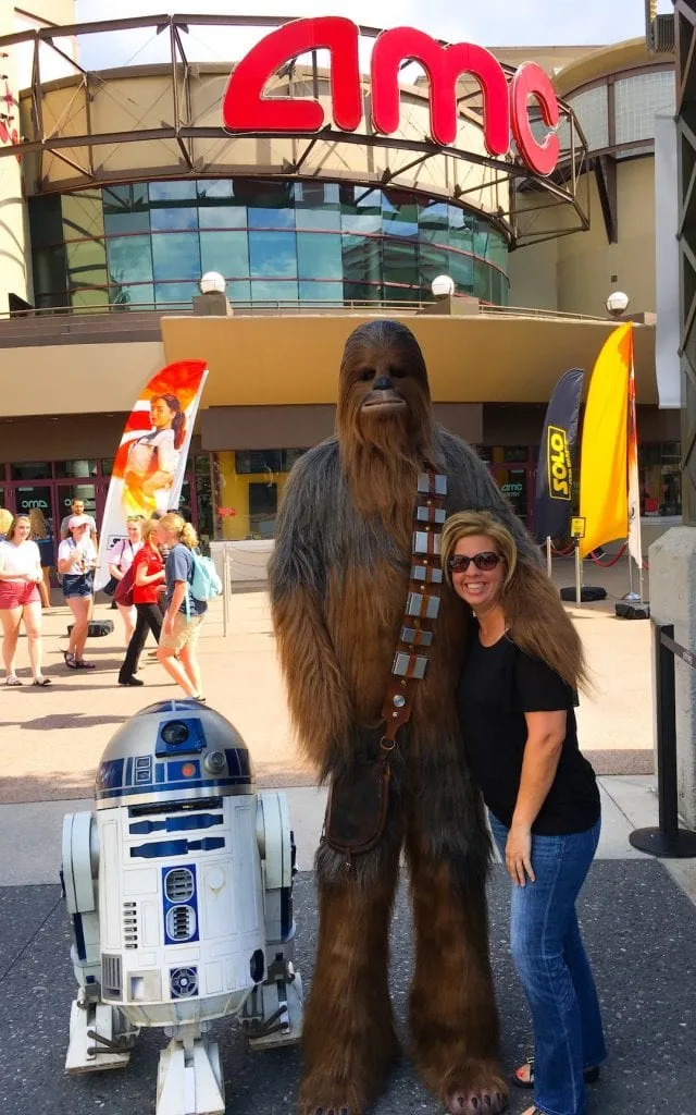 Kim with Chewbaca and r2d2 at Disney springs for Star Wars movie
