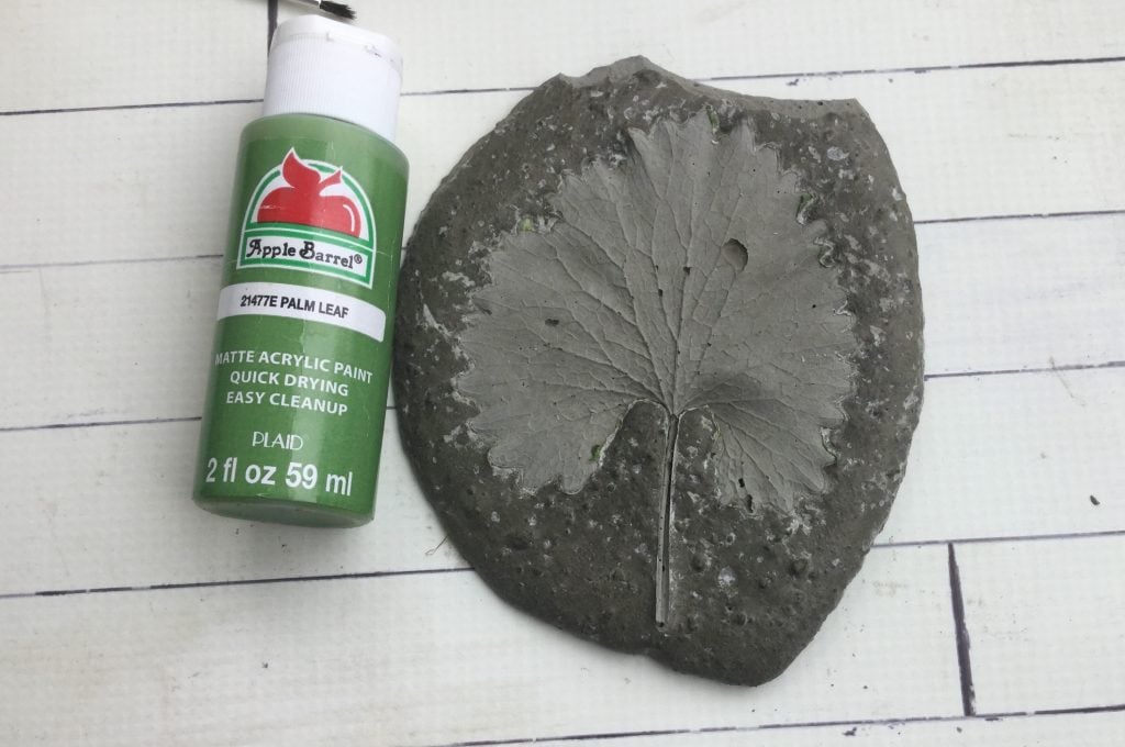 leaf imprint in concrete decorative garden stone with green paint