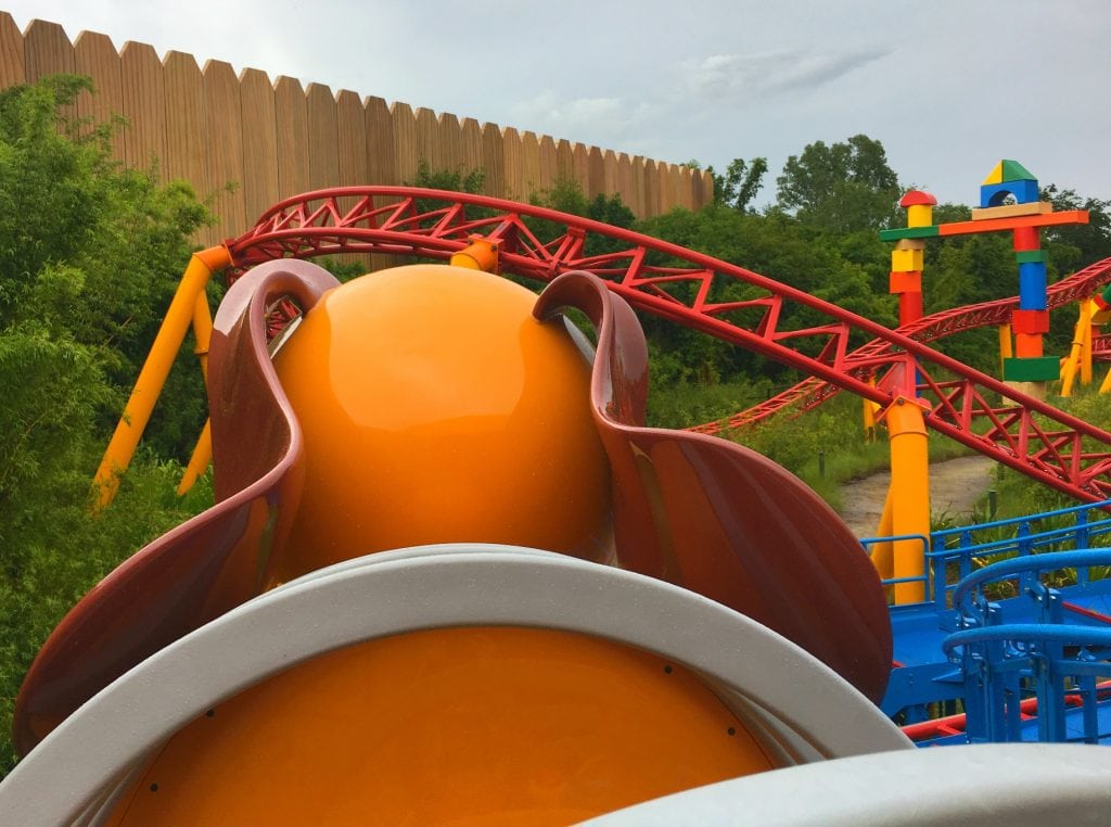 back of Slinky Dog head in row 1 of roller coaster at Toy Story Land
