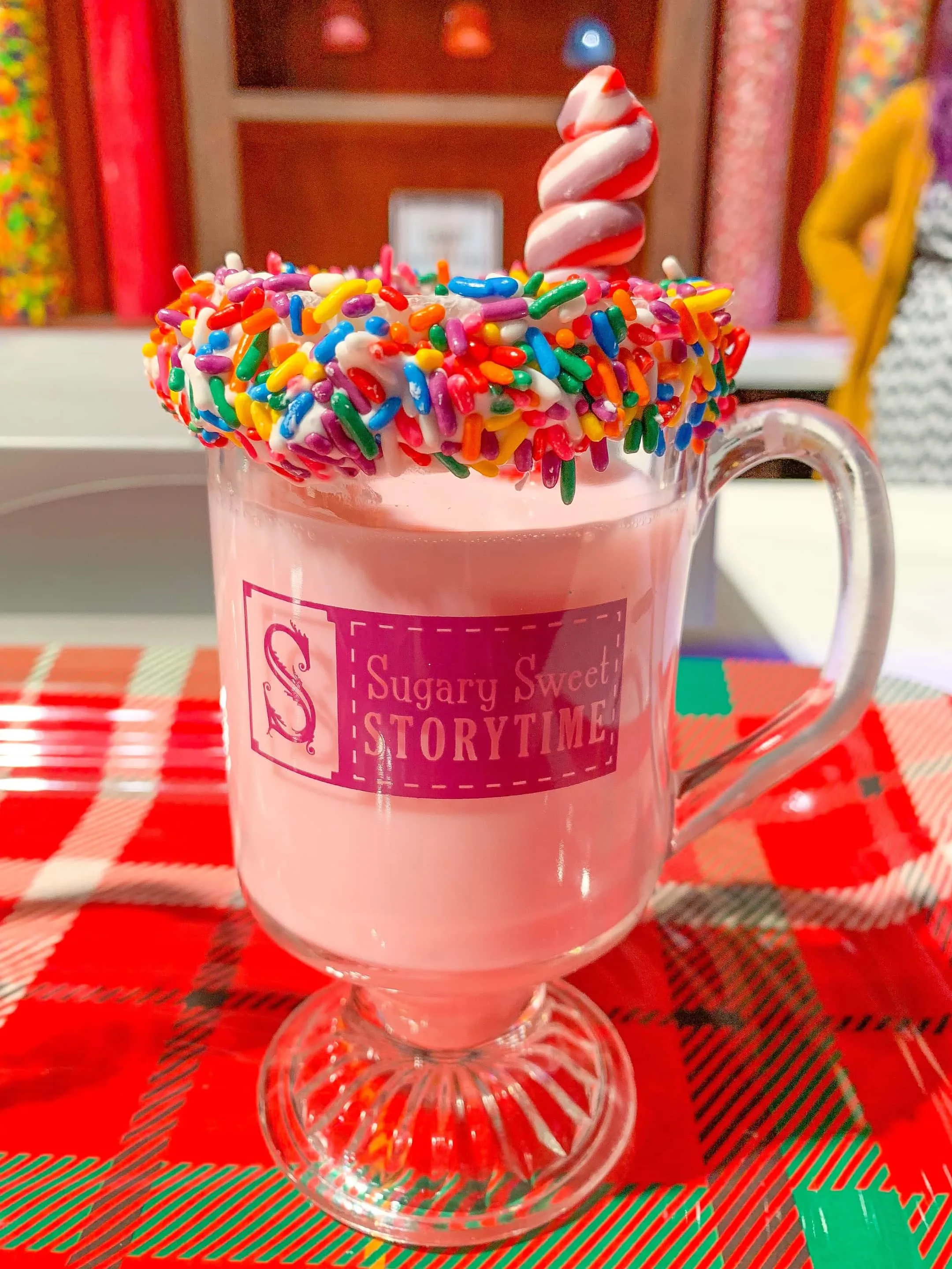 pink hot chocolate in glass mug with sprinkles on rim Gaylord Palms ICE 2018 Orlando