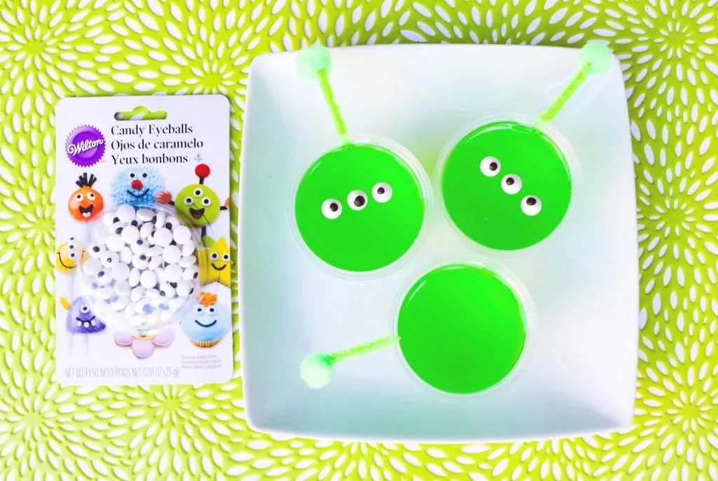 bright green gelatin cups with candy eyeballs 