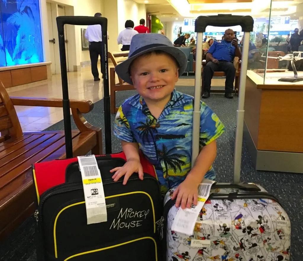 boy with two suitcases 
