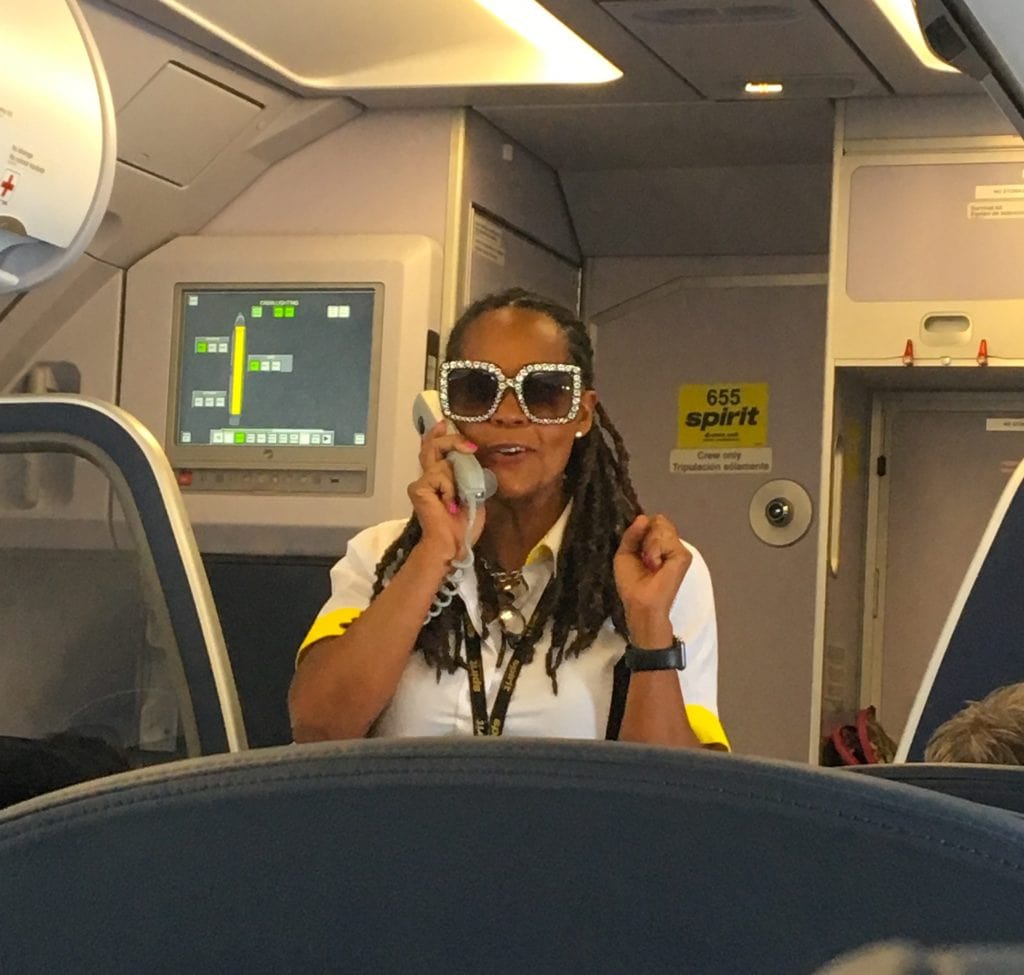 Spirit Airlines flight attendant giving boarding announcement