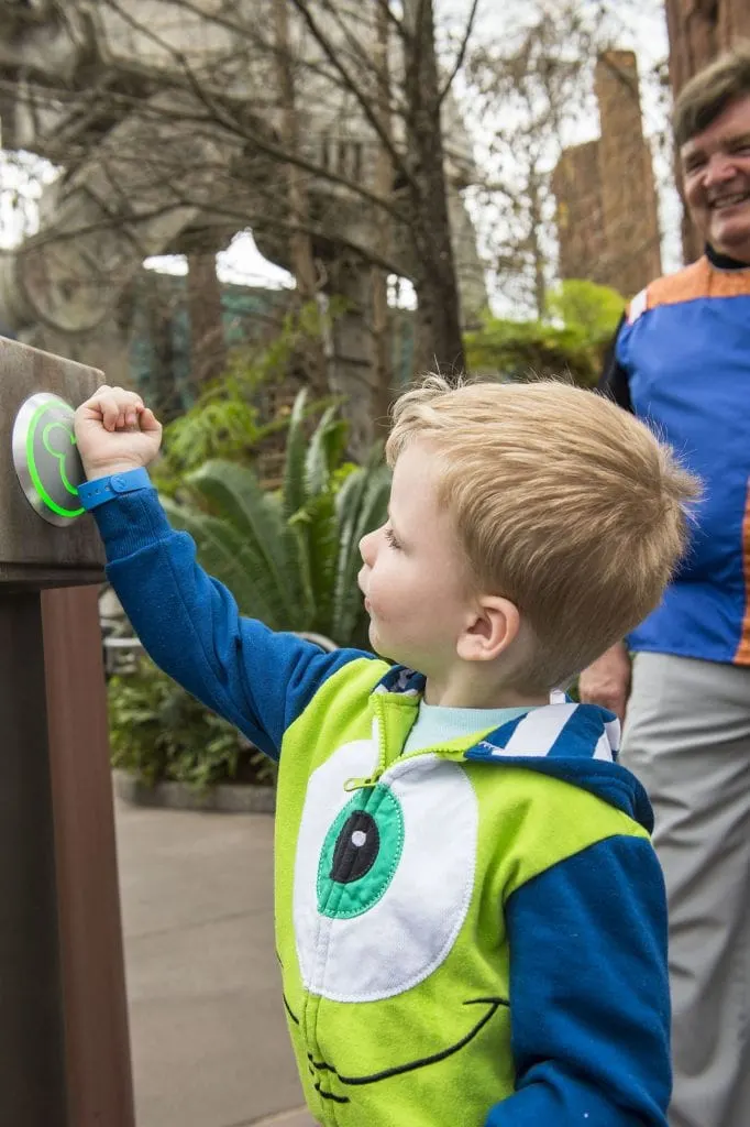 Boy Dressed in Monsters Costume using Disney World MagicBands