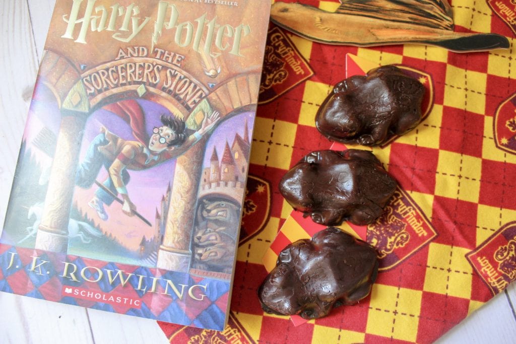 chocolate frogs candy next to Harry Potter book 