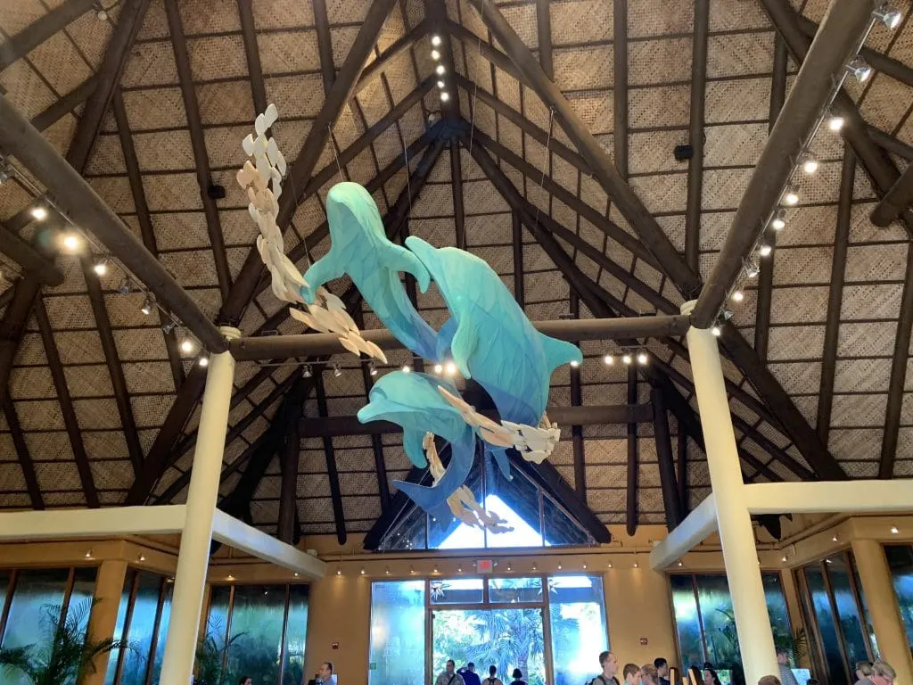 dolphin sculptures hanging from ceiling in entrance to Discovery Cove in Orlando Florida