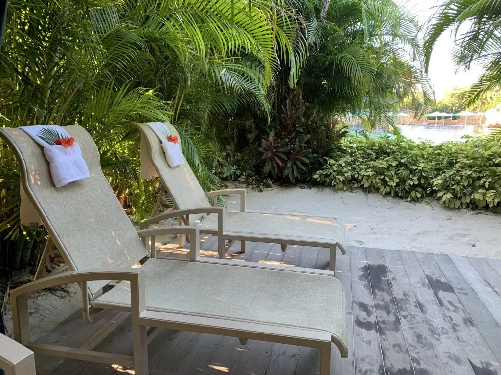 lounge chairs in sand in private cabana at Discovery Cove Orlando
