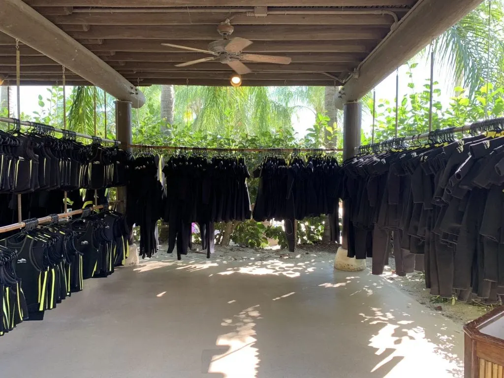 wet suits hanging on racks at Discovery Cove Orlando FL