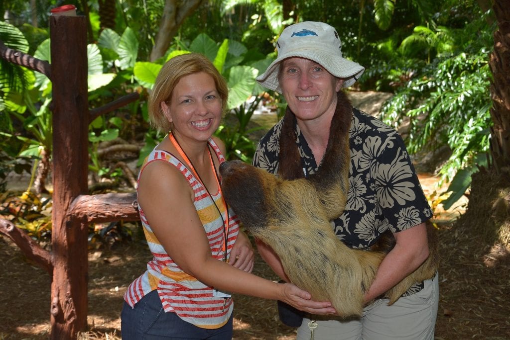 two women holding a sloth at Discovery Cove Orlando Florida