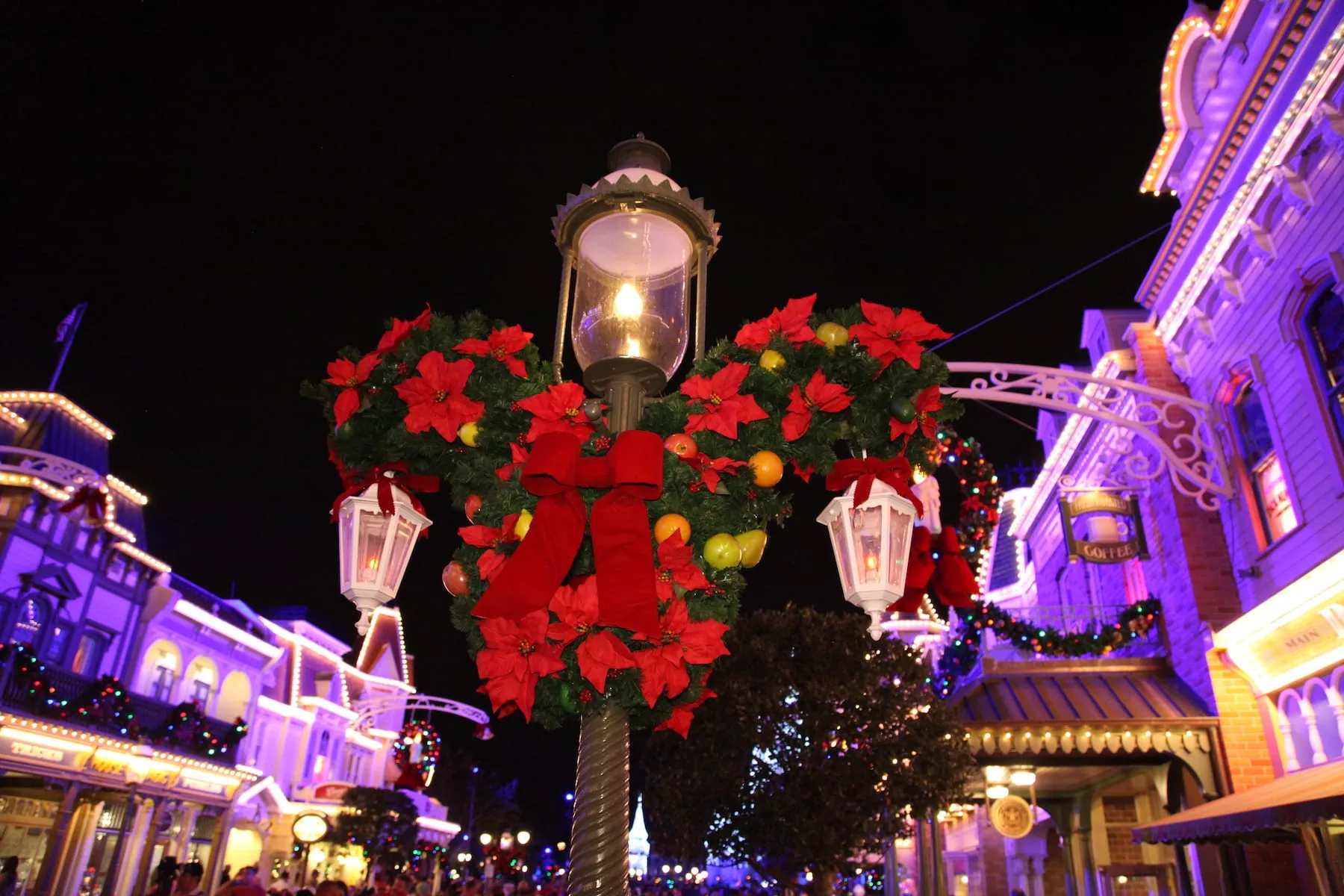 Mickey Mouse Head Shaped Christmas Wreath on Light Post Mickey's Very Merry Christmas Party Magic Kingdom