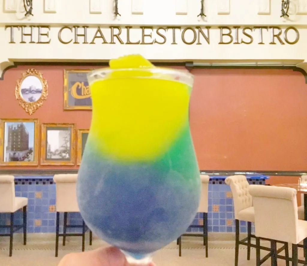 yellow green and purple frozen cocktail in glass at Charleston Bistro Lake Charles LA