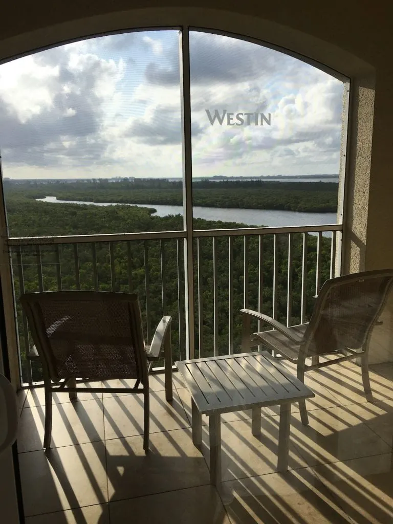 two chairs on private patio screened in overlooking river Westin Cape Coral fl
