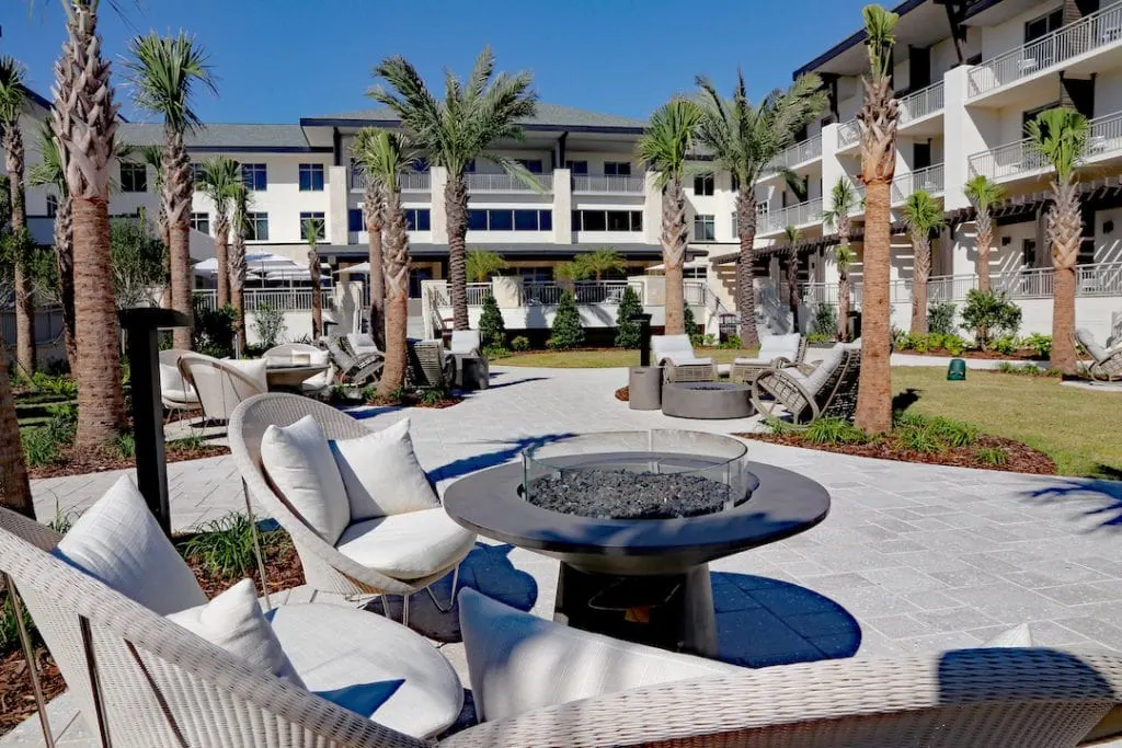 outdoor seating around metal firepit embassy suites st augustine beach oceanfront resort