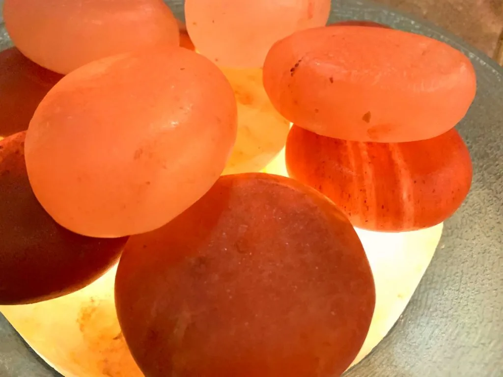 himalayan salt stones stacked on bowl for massage