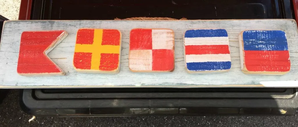 name made from nautical flags as letters