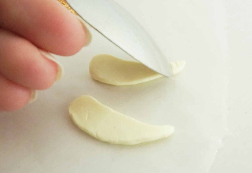 spoon on white clay wings to make feathers for Golden Snitch