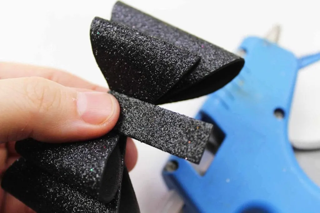 Making a Bow out of black glitter foam for Headband