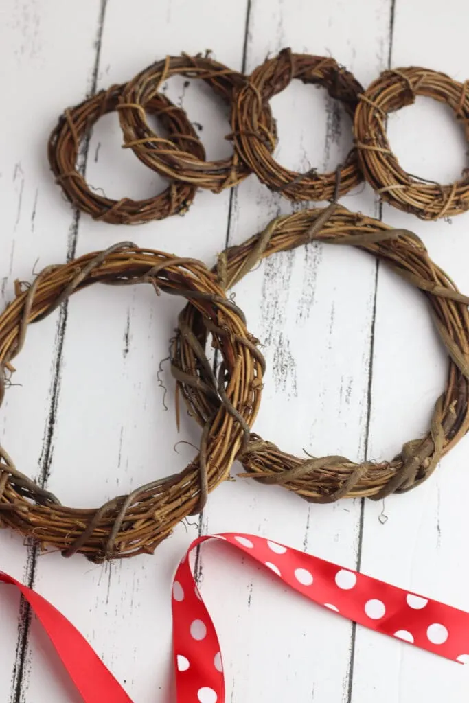 grapevine wreaths on white wooden background