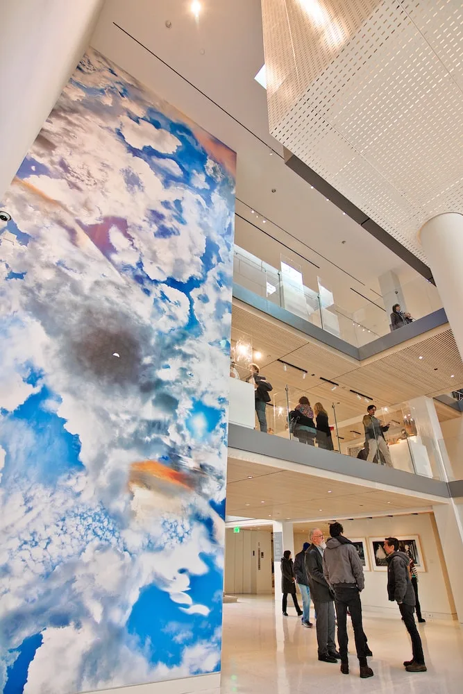 cloud mural on blue sky in lobby atrium
