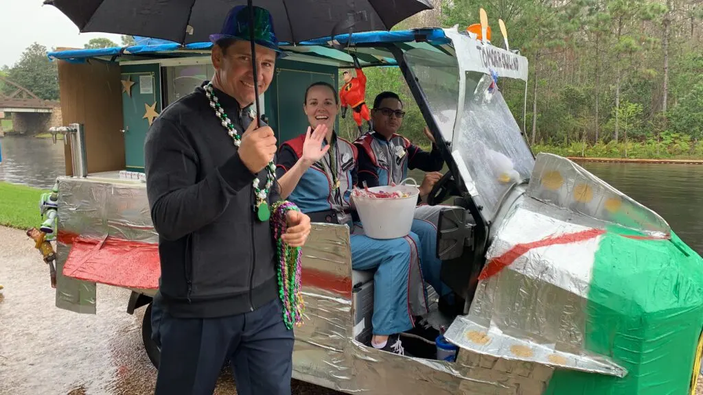 disney cast members throwing candy in Mardi Gras pargo parade