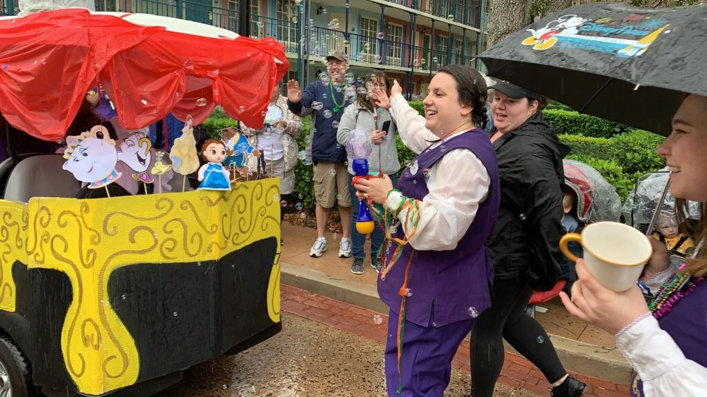 disney cast members blowing bubbles in Mardi Gras parade port Orleans resort