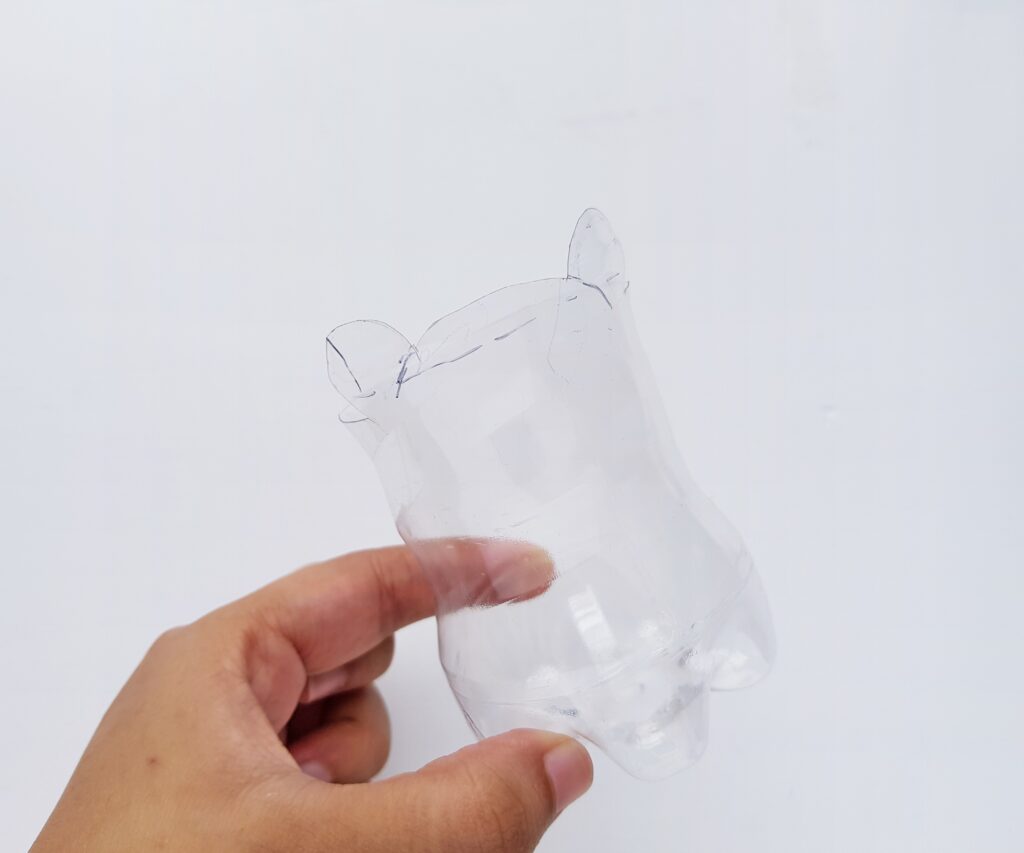 plastic water bottle cut in half