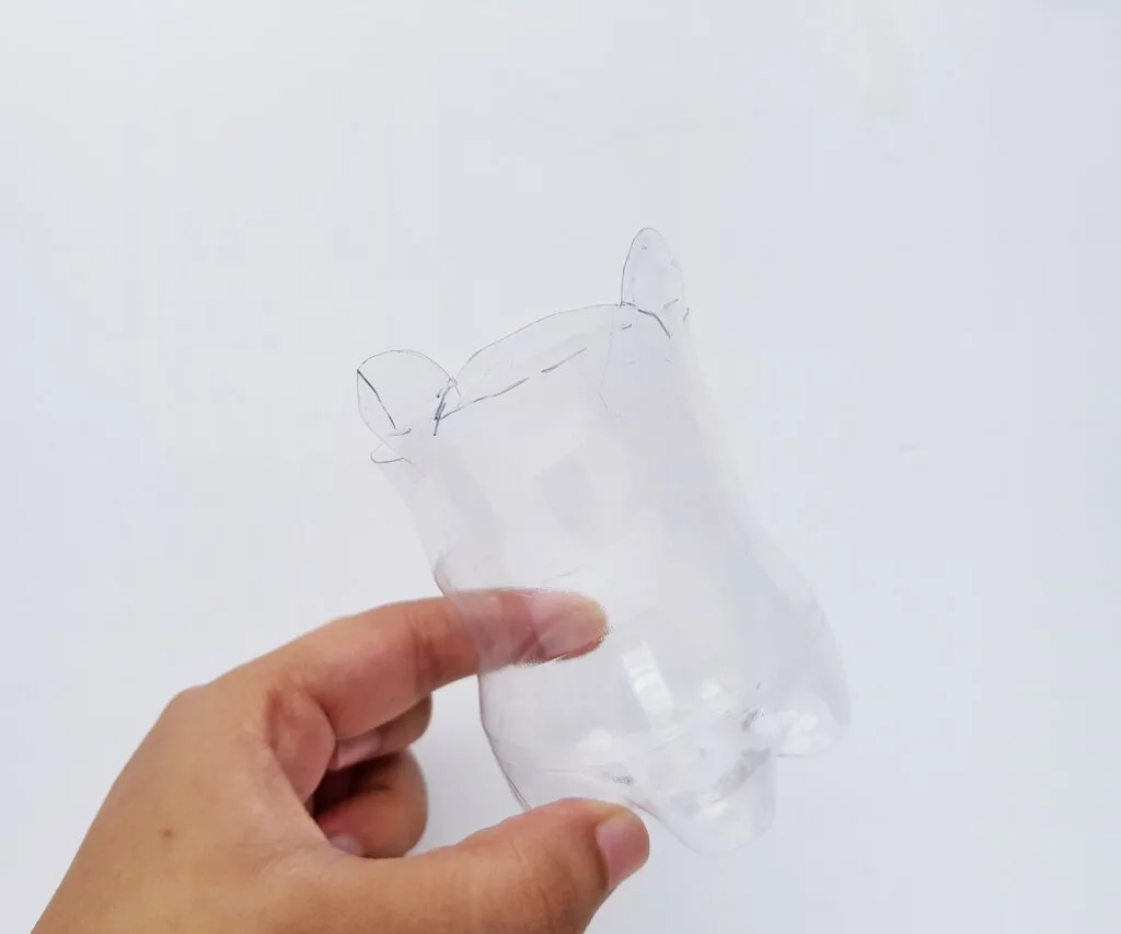 plastic water bottle cut in half
