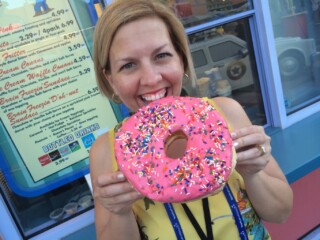 woman with huge pink iced donut at Universal Studios Orlando Resort