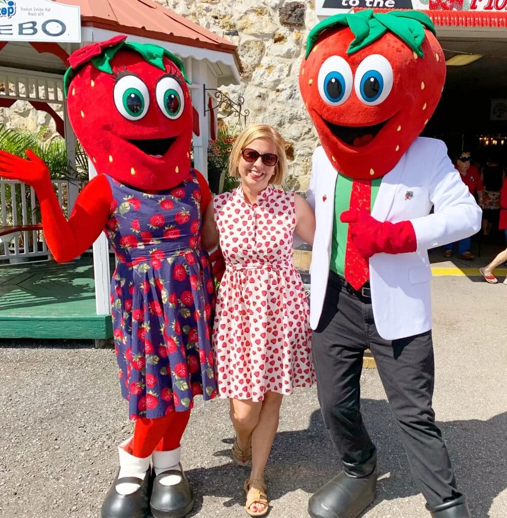 woman with strawberry mascot characters