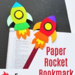 paper rocket craft bookmarks on book page