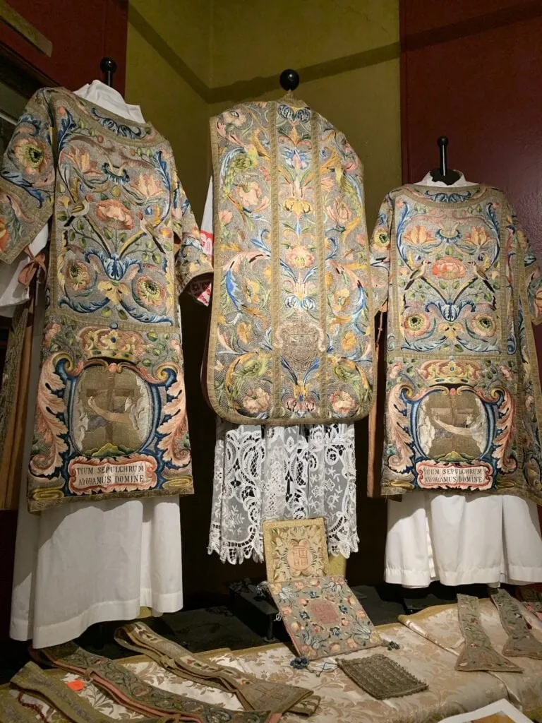 three embroidered robes for religious services