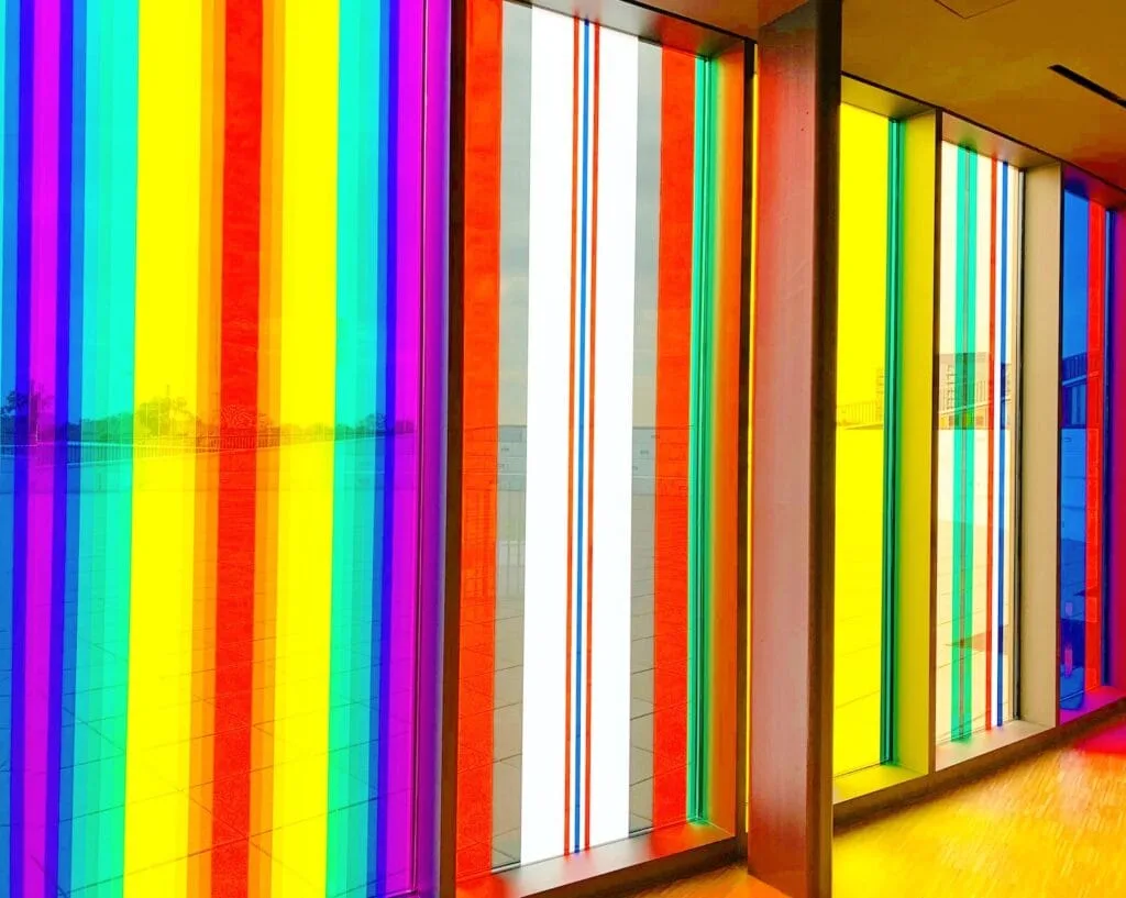 floor to ceiling windows with rainbow color stripes