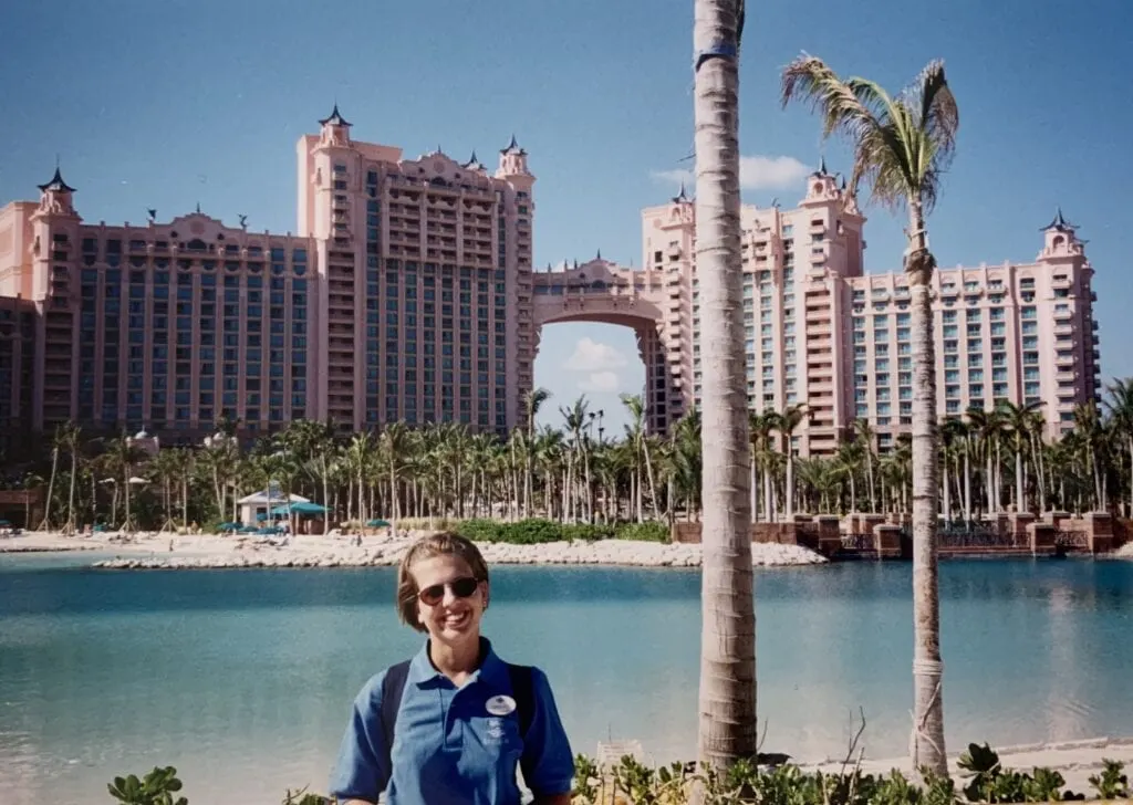 woman standing in front of Atlantis resort in Nassau Bahamas