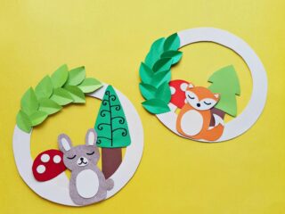 two paper wreaths with woodland animals