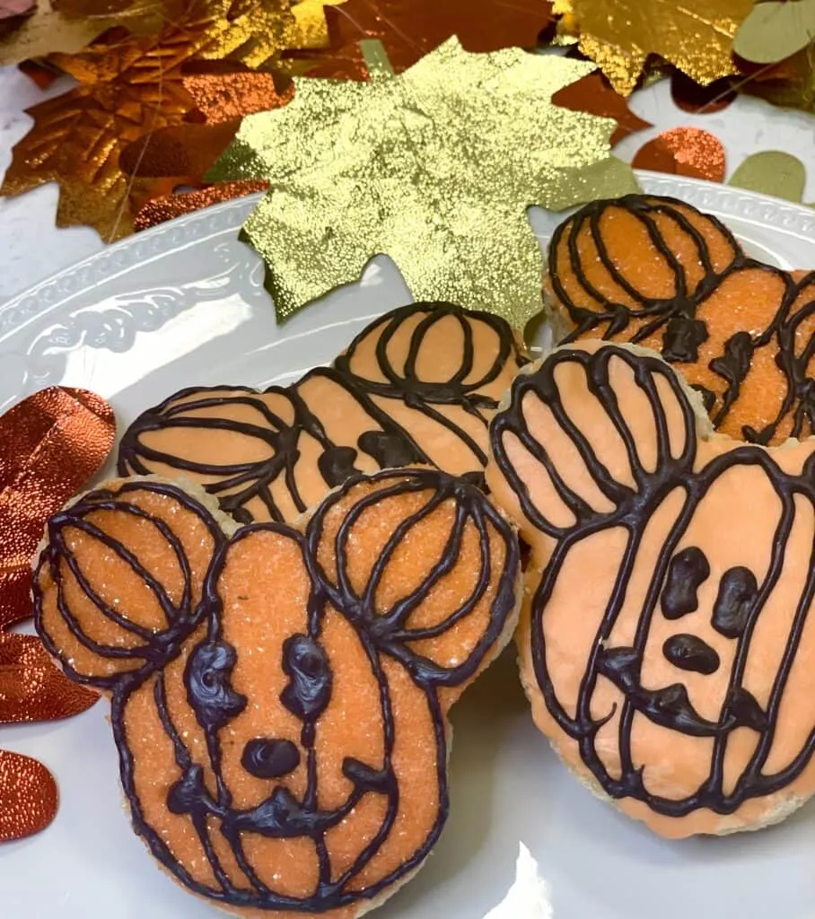 Mickey Mouse pumpkin snacks on a white tray