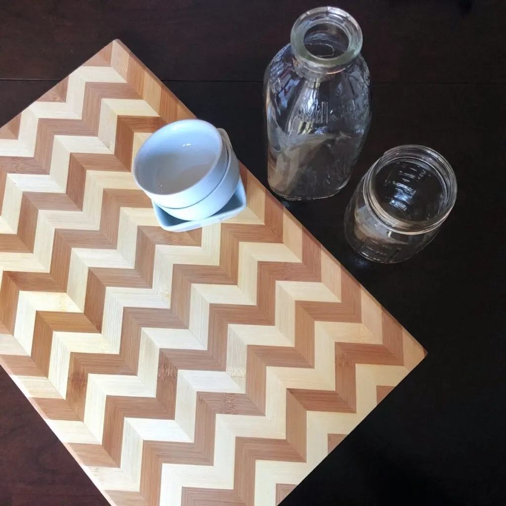 wooden cutting board and glass bowls