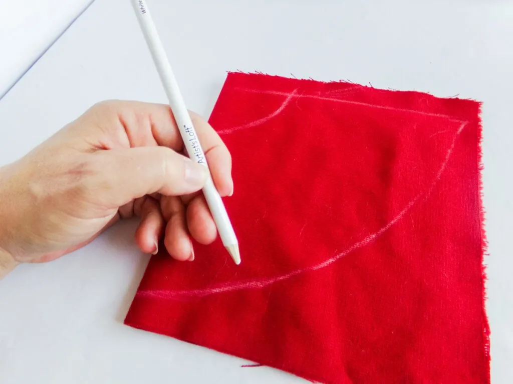 drawing half circles on red velvet fabric
