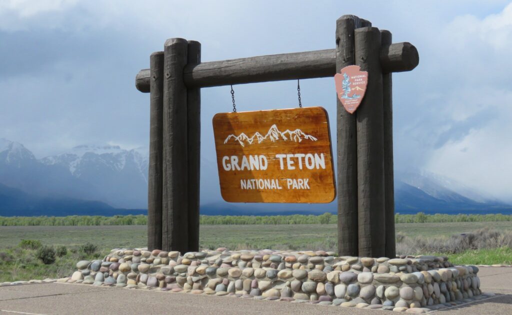 sign to the entrance of Grand Teton National Park