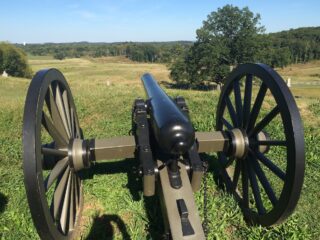cannon on hill in field in Gettysburg, PA